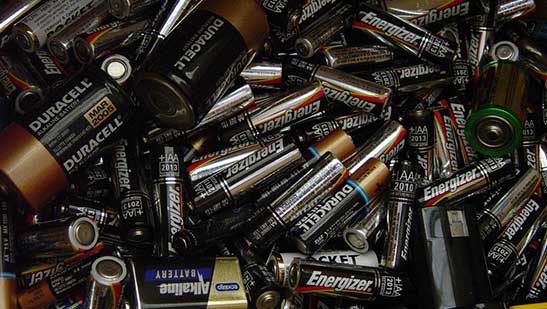 Pile of small duracell and energizer batteries